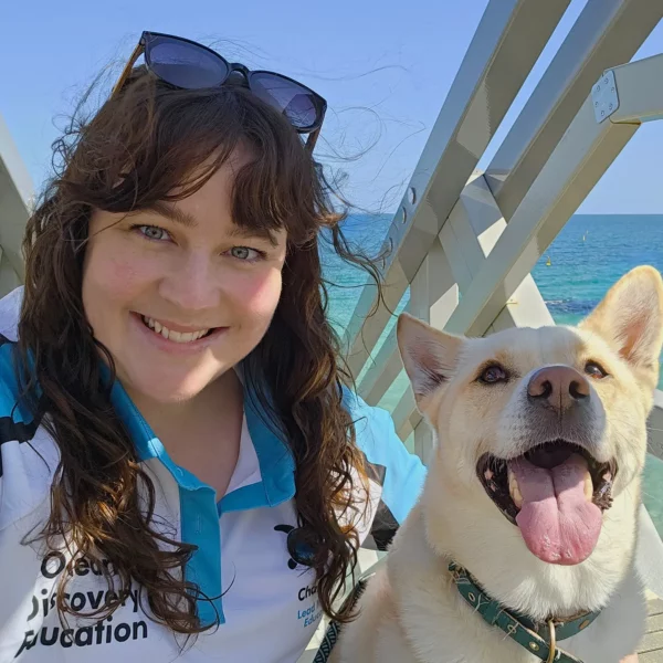 Charlotte Krause with her dog on a boat